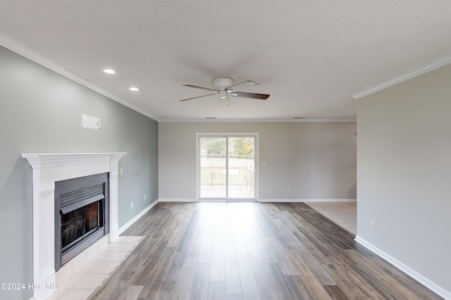 unfurnished living room with ornamental molding, ceiling fan, and light hardwood / wood-style floors