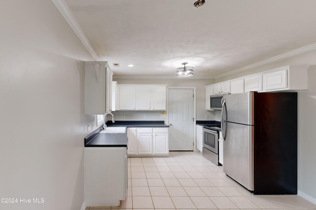 kitchen with white cabinetry, sink, crown molding, and stainless steel appliances