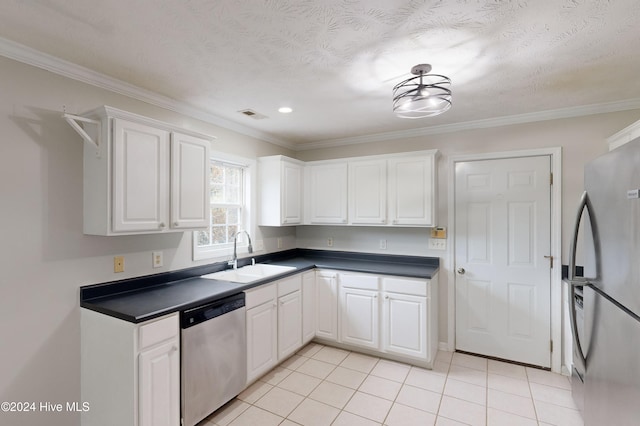 kitchen with stainless steel appliances, white cabinets, sink, and ornamental molding