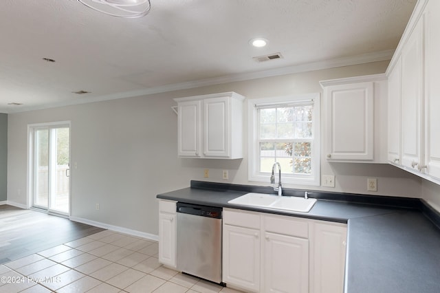 kitchen with light tile patterned flooring, crown molding, white cabinetry, sink, and dishwasher