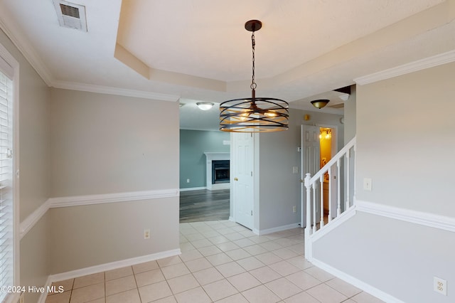 unfurnished dining area with an inviting chandelier, light tile patterned floors, and ornamental molding