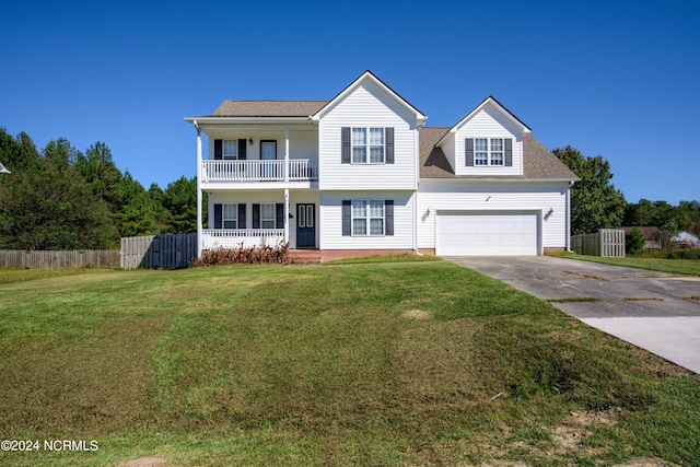 view of front facade featuring a balcony, a front yard, and covered porch