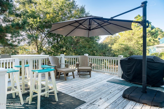 wooden terrace with area for grilling