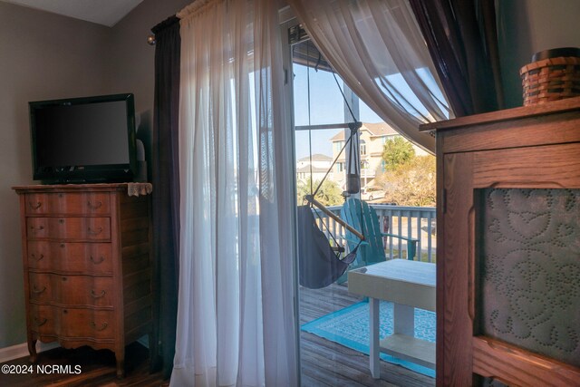 doorway to outside with hardwood / wood-style floors