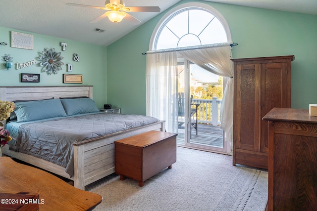 bedroom with ceiling fan, access to outside, a textured ceiling, vaulted ceiling, and light colored carpet