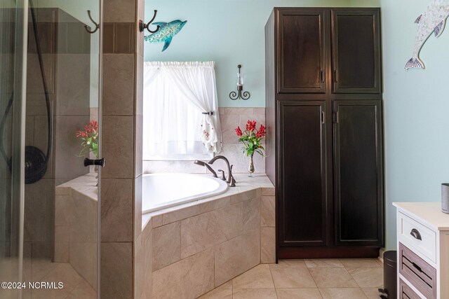 bathroom with vanity, separate shower and tub, and tile patterned floors