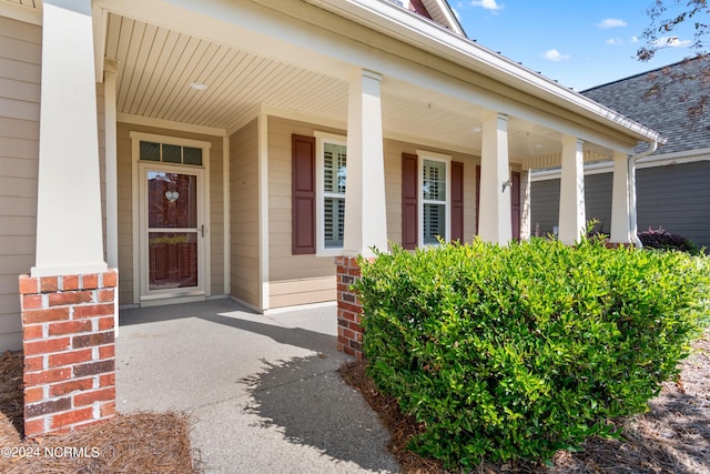 doorway to property with covered porch