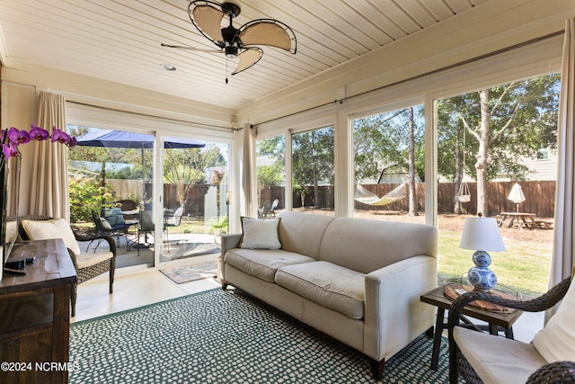 sunroom / solarium with wood ceiling and ceiling fan