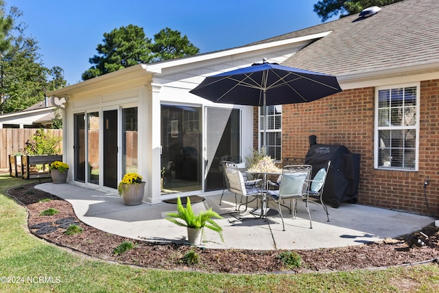 back of house with a patio