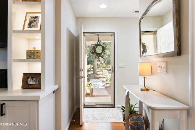 doorway to outside featuring dark hardwood / wood-style flooring