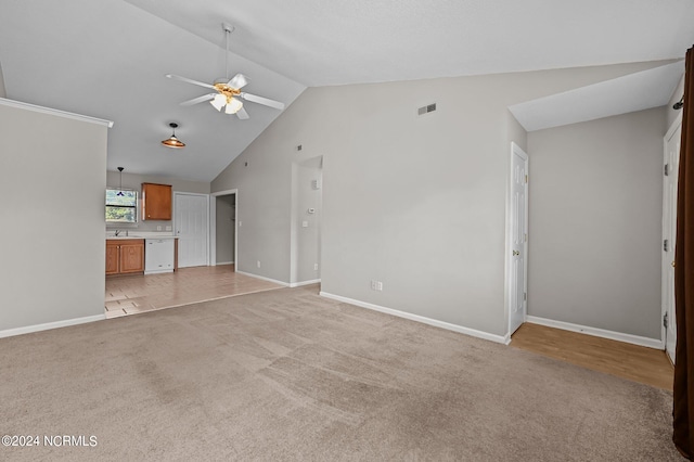 unfurnished living room with light carpet, lofted ceiling, and ceiling fan