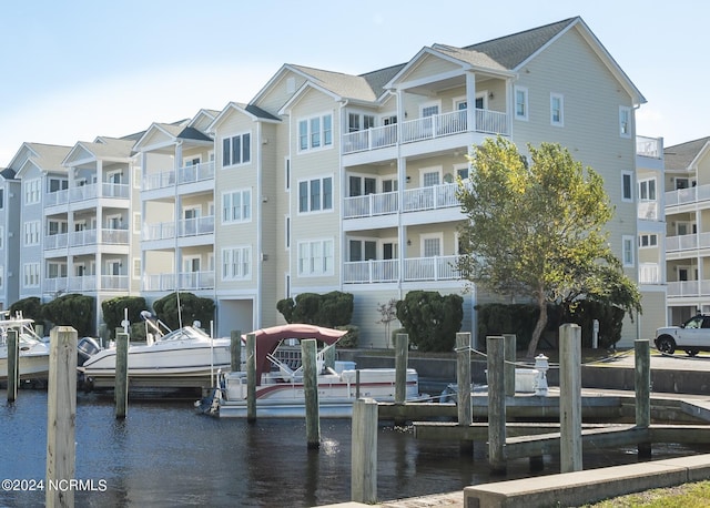 view of apartment building / complex with a water view