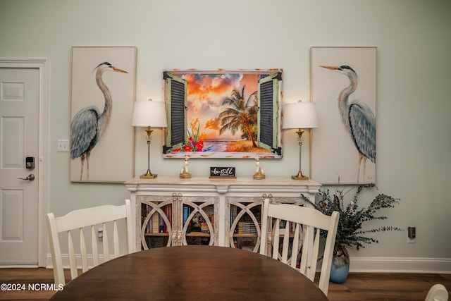 dining room with dark wood-type flooring