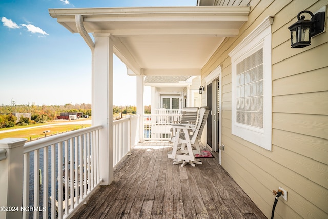 wooden terrace featuring a porch