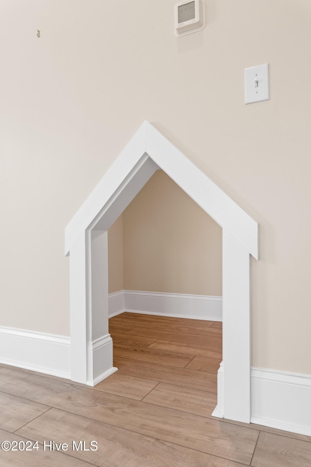 additional living space featuring wood-type flooring