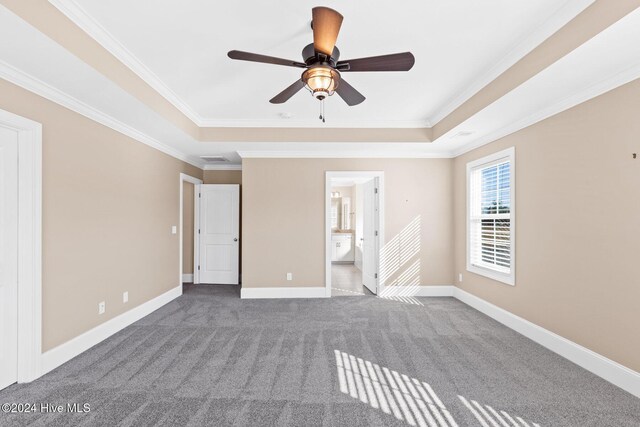 46 Covey Ct, Hampstead, NC 28443 - unfurnished bedroom featuring a raised ceiling, ornamental molding, baseboards, and carpet flooring