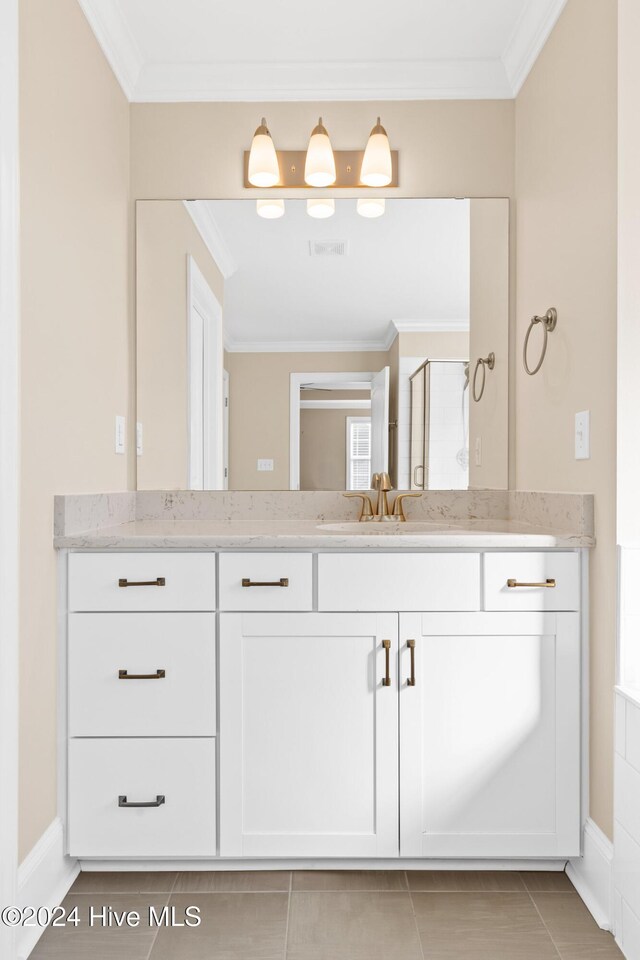 46 Covey Ct, Hampstead, NC 28443 - full bathroom featuring visible vents, a stall shower, vanity, tile patterned floors, and ornamental molding