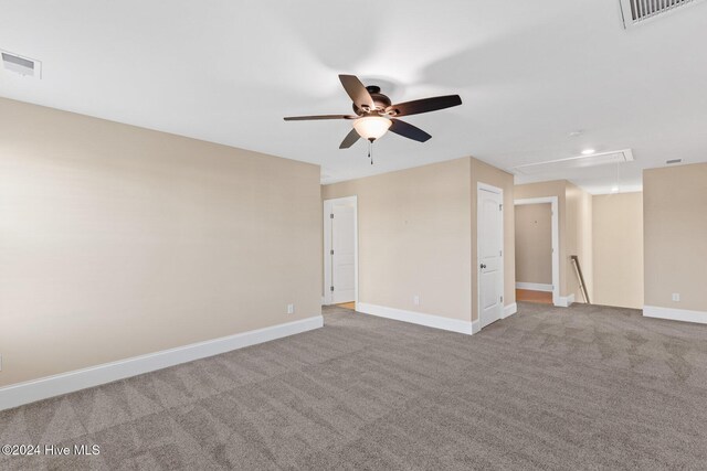 46 Covey Ct, Hampstead, NC 28443 - spare room featuring visible vents, attic access, a ceiling fan, and carpet floors