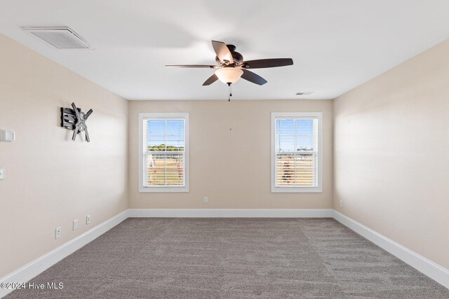 46 Covey Ct, Hampstead, NC 28443 - spare room with ceiling fan, carpet, and visible vents
