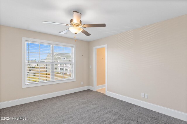 46 Covey Ct, Hampstead, NC 28443 - empty room featuring a ceiling fan, baseboards, and carpet
