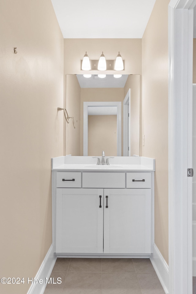 bathroom with vanity and tile patterned floors