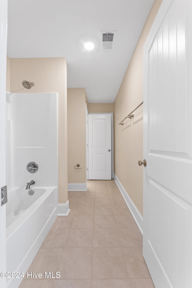 bathroom featuring tile patterned floors and shower / washtub combination