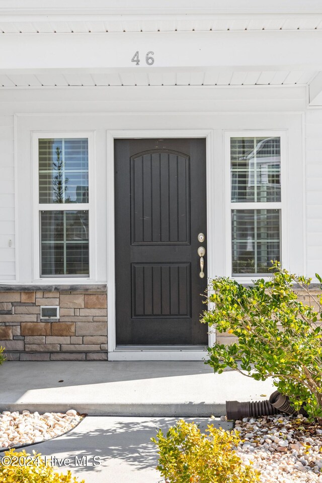 46 Covey Ct, Hampstead, NC 28443 - property entrance featuring stone siding