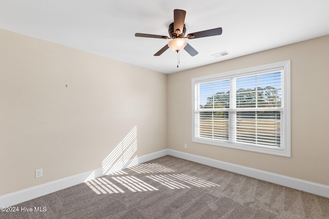 empty room featuring carpet and ceiling fan