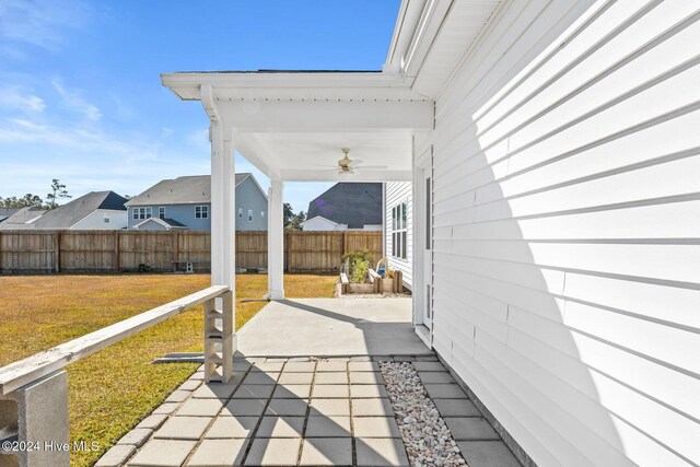 46 Covey Ct, Hampstead, NC 28443 - view of patio / terrace featuring a fenced backyard, a ceiling fan, and a residential view
