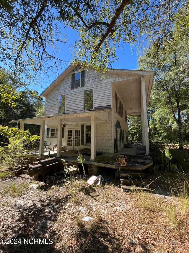 back of property featuring french doors