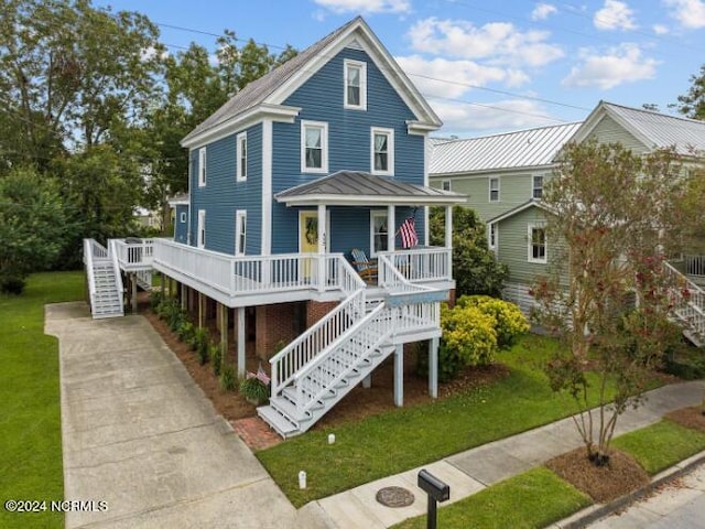 view of front of house with a front lawn and covered porch