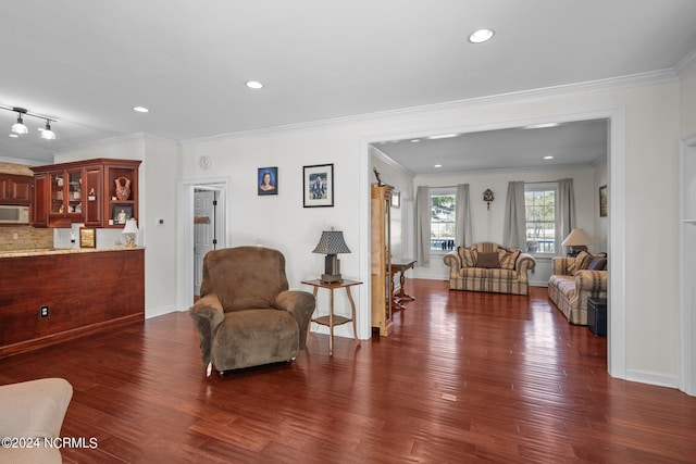 living room with ornamental molding and dark wood-type flooring