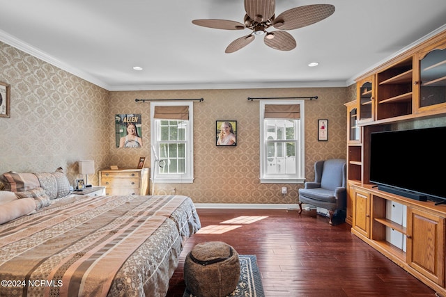 bedroom with crown molding, dark hardwood / wood-style floors, and ceiling fan