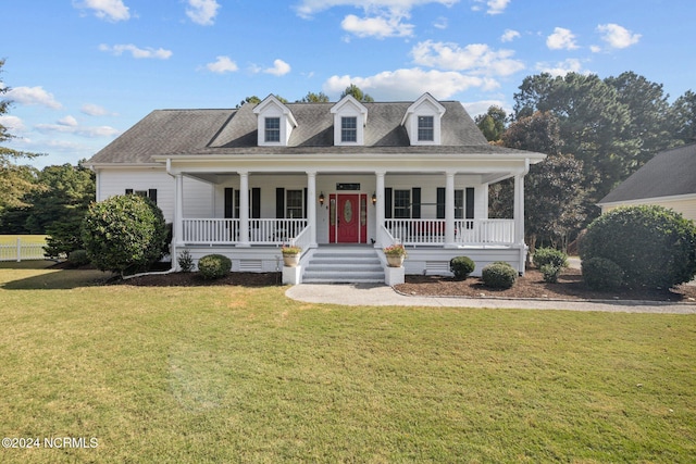 cape cod-style house featuring covered porch and a front yard