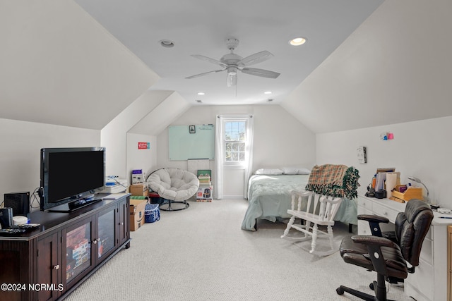 carpeted bedroom with vaulted ceiling and ceiling fan