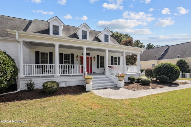 view of front of house featuring a front yard and a porch