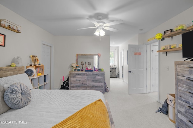 bedroom with light colored carpet and ceiling fan