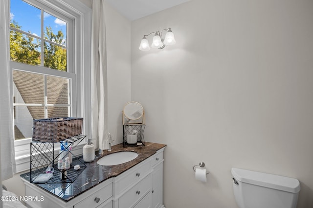 bathroom with vanity and toilet