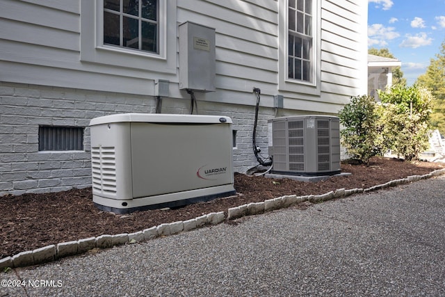 details featuring cooling unit and carpet flooring