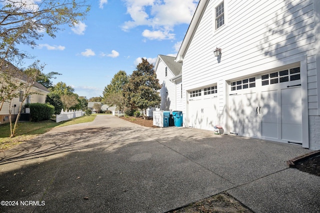 view of side of property featuring a garage