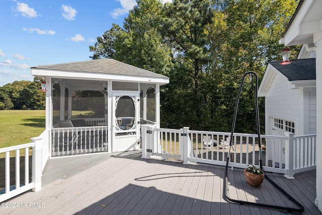 wooden deck with a sunroom