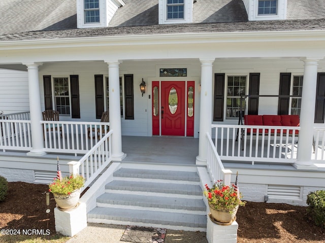 doorway to property with a porch