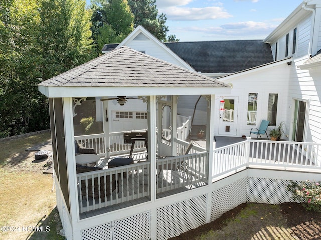 wooden terrace featuring ceiling fan