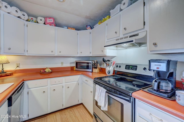 kitchen featuring white cabinetry, appliances with stainless steel finishes, and light hardwood / wood-style floors