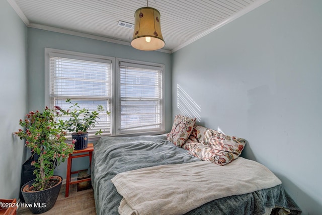 bedroom with crown molding