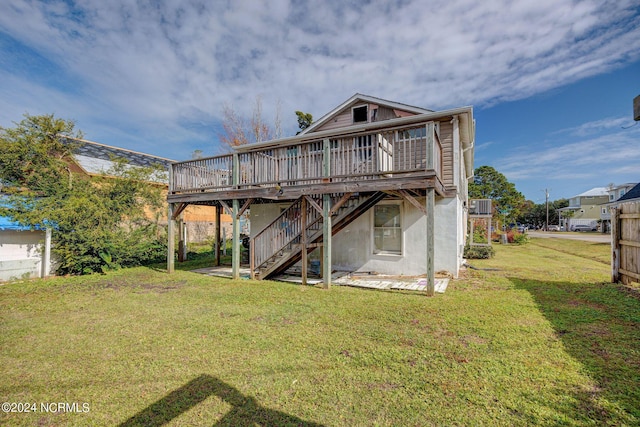 rear view of property with a wooden deck, a lawn, and central air condition unit