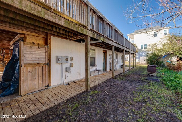 view of home's exterior featuring a wooden deck