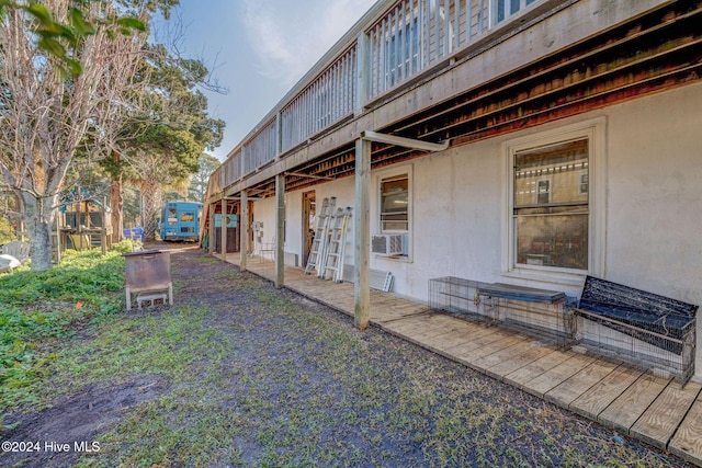 view of yard with cooling unit and a wooden deck