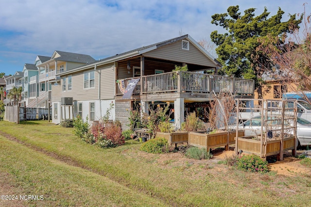 rear view of house with a lawn