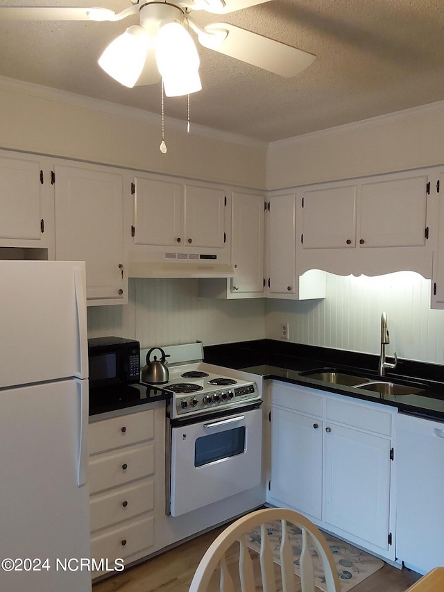 kitchen featuring light hardwood / wood-style flooring, sink, crown molding, white cabinetry, and white appliances